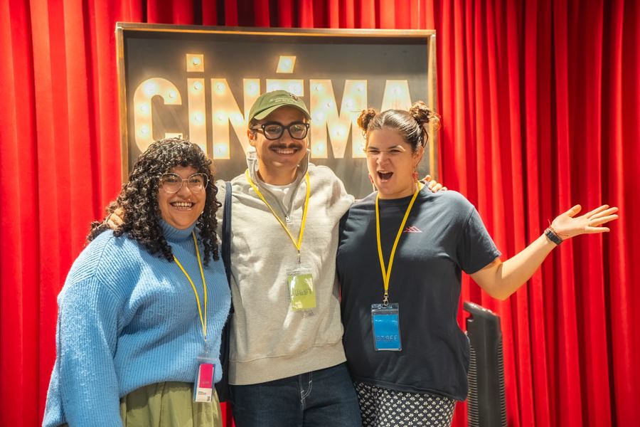 Román Ruberti Godoy with the VLAFF team in front of a cinema sign